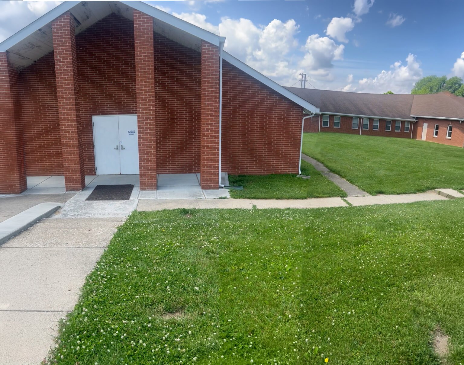 Guiding Light Church's red-brick building and entrance on Groveport Road