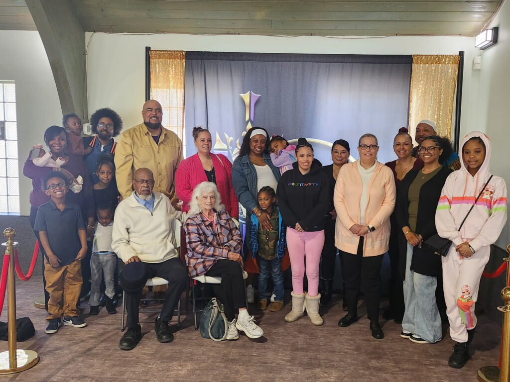 The Guiding Light Church family, children through elders, gathered together in the sanctuary