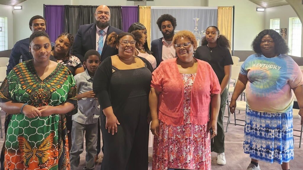 Members of Guiding Light Church smiling together after service